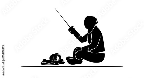 Focused fencer holding foil poised for action in silhouette