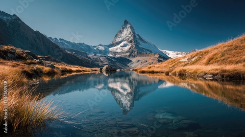 Majestic mountain peak reflected in a serene alpine lake