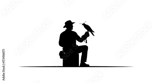 Skilled falconer with majestic bird perched on gloved hand demonstrates ancient art