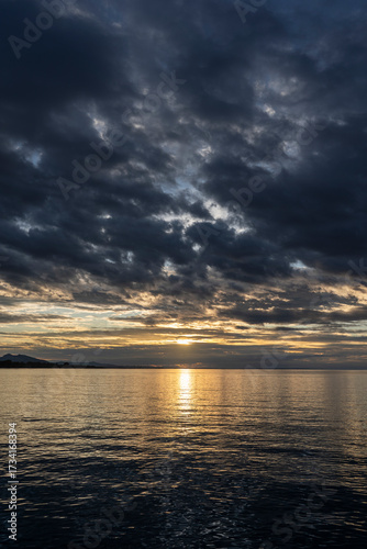 sunset over Lake Constance / Bodensee in Bregenz Vorarlberg Austria with clouds and intense colours and blue sky