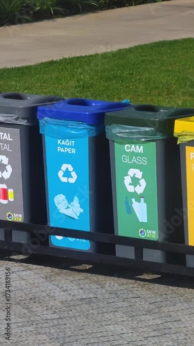 Plastic bins, garbage cans, recycling. Colored boxes, waste sorting, metal, plastic, glass, paper, organic. Colorful waste, with recycling sign. Saving the natural environment. An ecological approach 