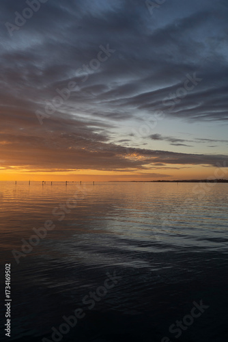 sunset over Lake Constance / Bodensee in Bregenz Vorarlberg Austria with clouds and intense colours and blue sky