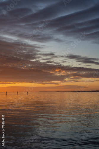 sunset over Lake Constance / Bodensee in Bregenz Vorarlberg Austria with clouds and intense colours and blue sky