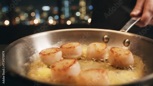 perfectly seared scallops cooking in sizzling butter pan