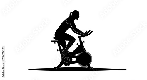 Woman cycling vigorously on stationary bike, embodying fitness and active lifestyle goals