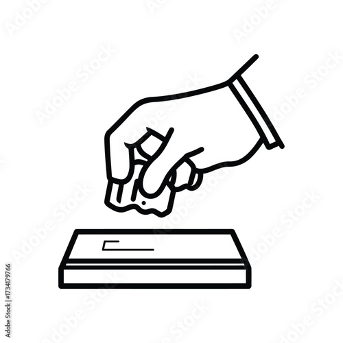 Hand wearing a glove cleaning a surface with a crumpled cloth or paper