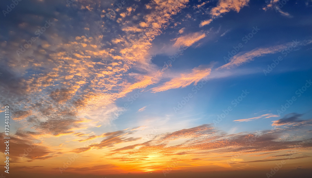 Fototapeta premium Sunset With Cirrus Clouds Beautiful Cloud Patterns At Dusk Sunrise Orange Clouds In The Sky Sky Background Sky Gradient Twilight Heaven Nature Blue Sky