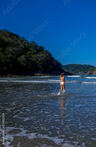 Brazilian woman in bikini on the beach