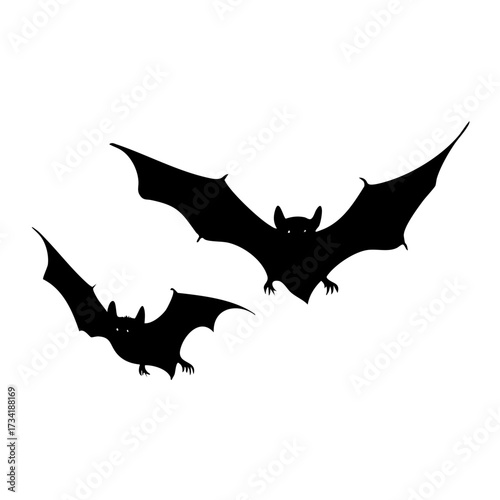 Black silhouette of two flying bats with outstretched wings isolated on transparent background
