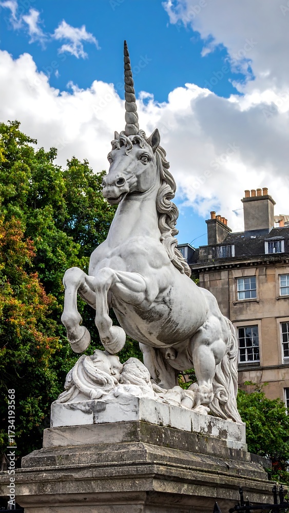 Fototapeta premium Majestic white unicorn statue in a city park