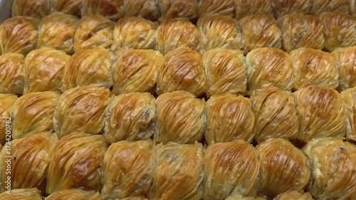 Baklava, dessert made from syrup and honey. Oriental sweets on showcase in assortment. 