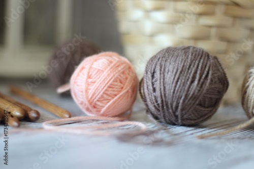 Clews balls of yarn wool and crochet hooks and a basket photo 