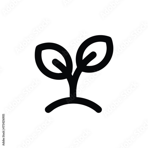 Young sprout emerging from soil with two leaves symbolizing growth and new beginnings in a natural environment