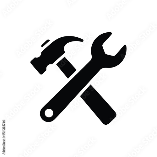 Close-up of a wrench and hammer crossed over each other on a plain , symbolizing tools and maintenance work