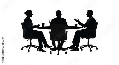 Business professionals meeting around a table in dark silhouette