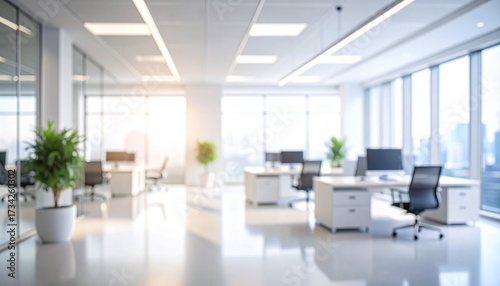 Soft focus view of a contemporary open-plan office interior with natural light, creating a bright and professional business background
