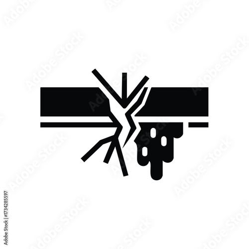 Cracked pavement with debris and broken indicating damage or deterioration in an urban environment