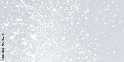Winter background abstract with snow is dancing randomly on grey background, Softly falling delicate white sparkles and bokeh lights background with winter seasonal concept abstract background.