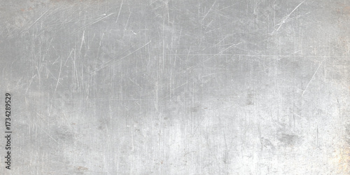 Grey scratched old metal surface steel texture with various scratches, Elegant rustic old brushed metal texture background with modern industrial steel surface design for sleek contemporary style.