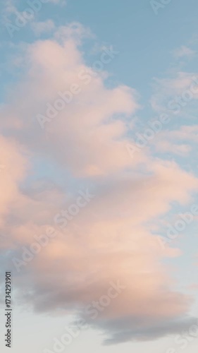 Clouds Tinged Orange at Sunset (Vertical, Timelapse)