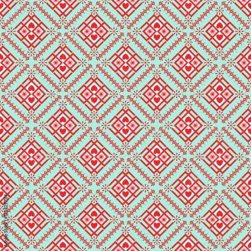The design features red diamond shapes, each filled with hearts and flowers, arranged across the entire fabric. The background is green, while the motifs are in red. Additional flowers are placed arou