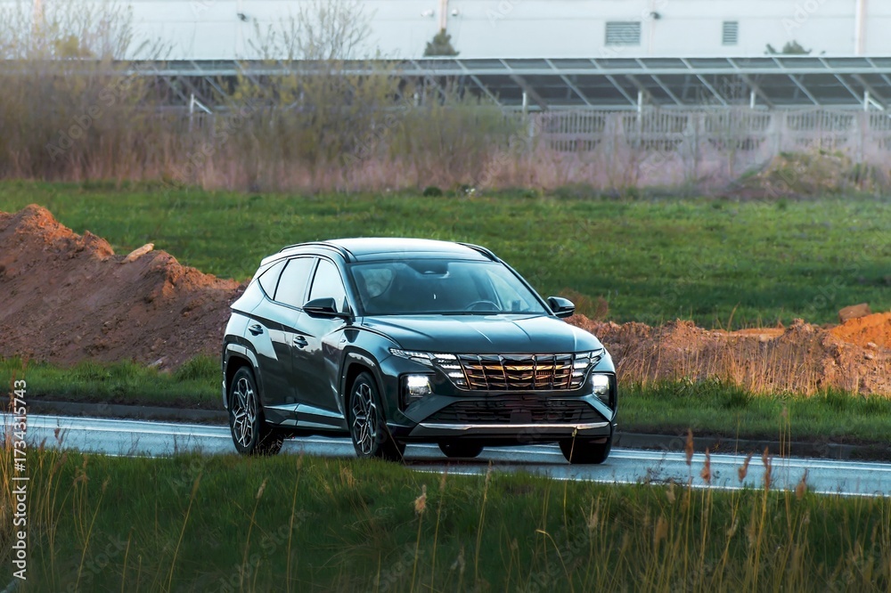 Fototapeta premium Driver in electric car cruising open space