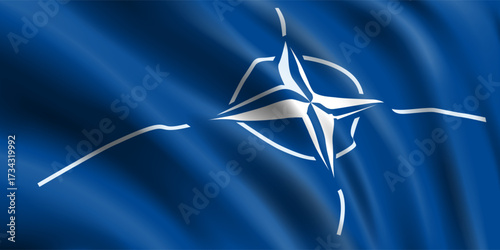 Waving blue flag with symbol NATO. Closeup.