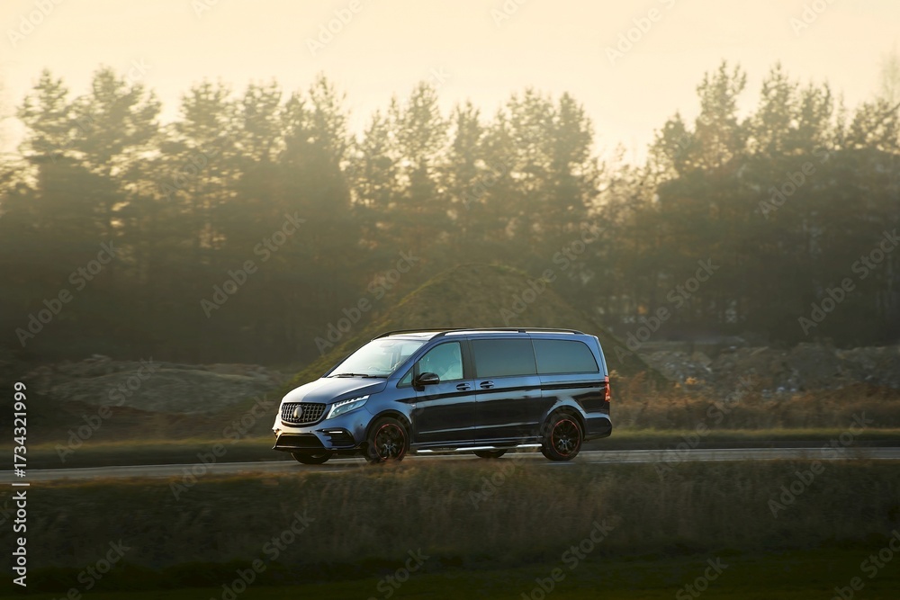 Fototapeta premium Hybrid automobile traveling through urban area