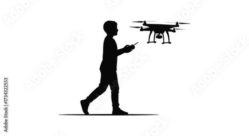 A boy operating a drone with a remote control dramatic silhouette