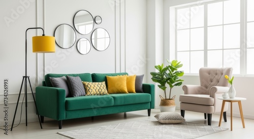 Bright modern living room with green sofa, armchair, and decor. Large windows let in natural light, creating a warm, welcoming atmosphere.