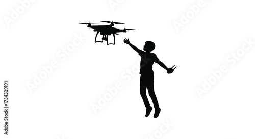 A boy reaching for a drone in a dynamic contrasting silhouette