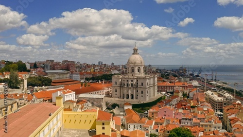 Aerial panoramic view Lisbon Portugal with National Pantheon dome historic red rooftops Tagus River waterfront iconic European capital cityscape cultural heritage travel destination old city tourism