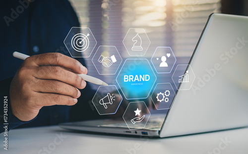 Brand awareness strategy concept, businessman touch digital brand awareness icons, communication, target, Marketing growth, customer loyalty, and partnership symbols for corporate branding success