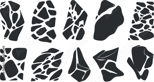 A collection of abstract black and white shapes resembling stones and rocks in various forms..