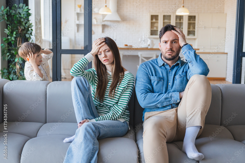 Obraz premium Headache, parents and child by sofa with adhd, running and impulsive behavior with motion at home. Family, mother and father on couch for annoyed, stress and hyper active of kid in house