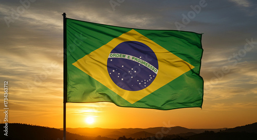 Brazilian flag against the backdrop of the southern sunset