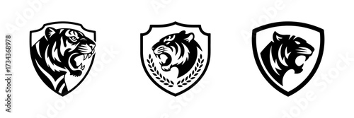 A fierce tiger head mascot inside a shield. A powerful emblem for sports teams, security companies, or any brand wanting to show strength and protection.
