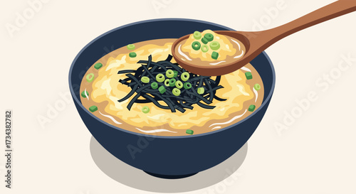 A close up of a bowl of savory porridge topped with green onions and seaweed served with a wooden spoon.