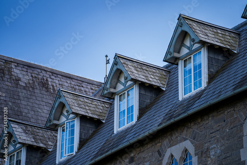 Photography Dormer windows on traditional stone roofline