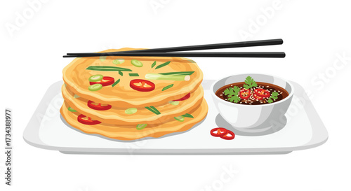 Delicious savory pancakes with chili and green onions served with dipping sauce.