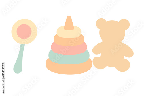 Assortment of pastel baby toys featuring a classic rattle, colorful stacking rings, and a cute teddy bear silhouette