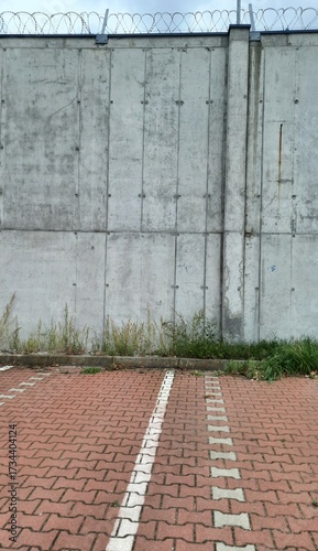 concrete wall with metal fence