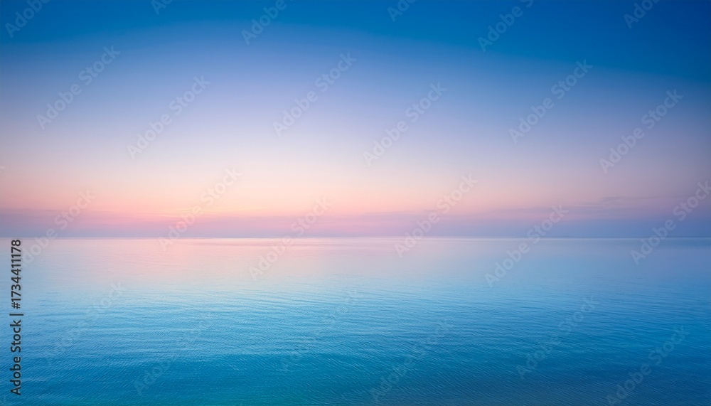 Obraz premium beautiful sunrise over the sea with blurred pastel toned background serene pink and blue sky blending into calm water peaceful natural landscape ideal for wallpapers digital art or tranquil themed