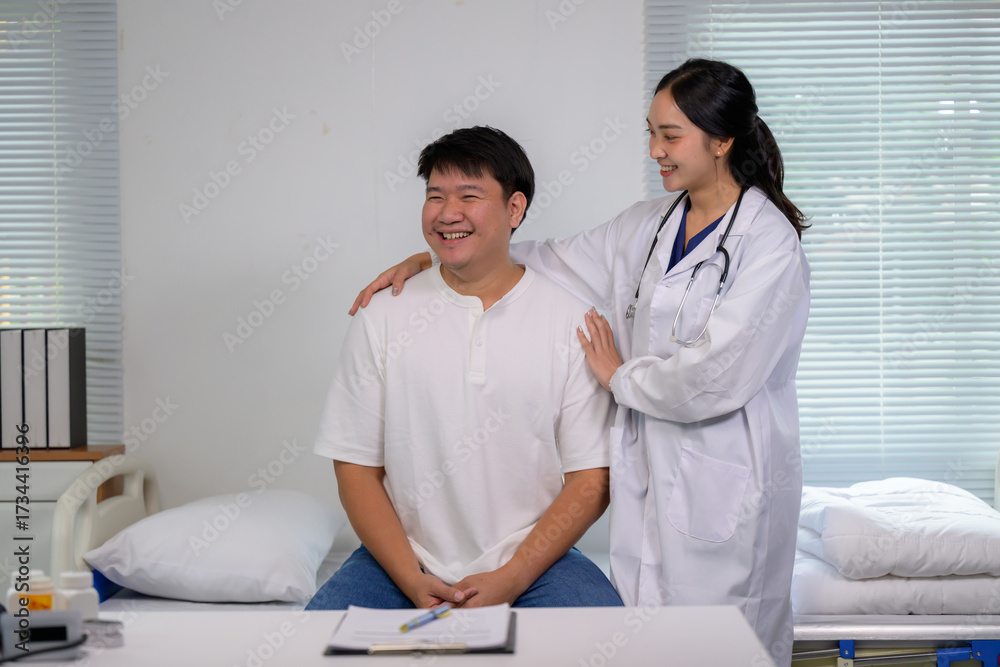 Fototapeta premium Doctor reassuring happy patient during hospital consultation