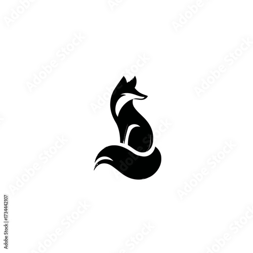 Elegant black fox silhouette seated, tail curled