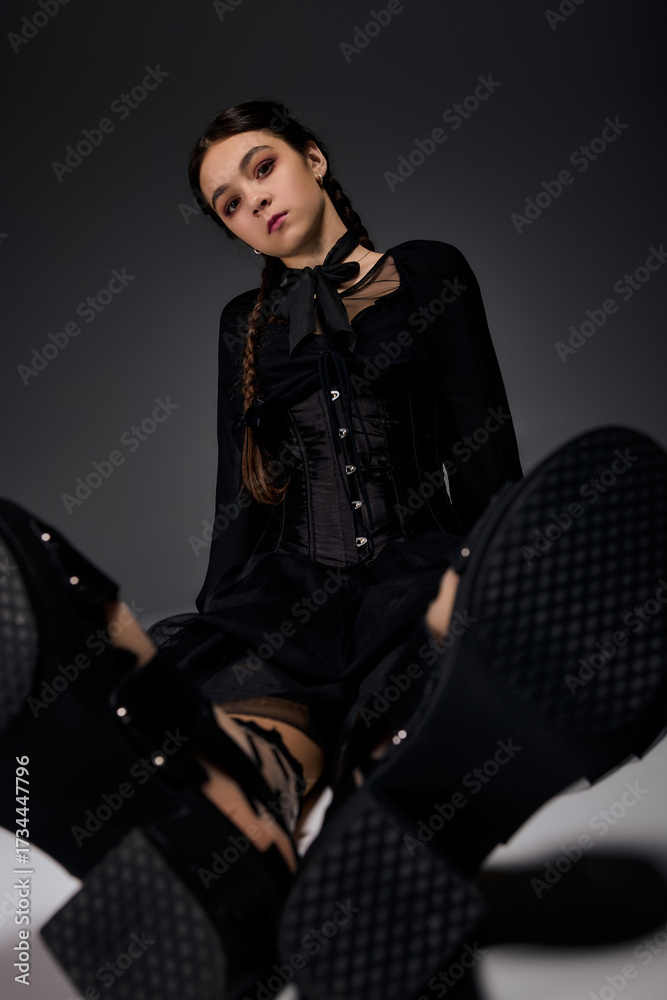 Naklejka premium Spooky season look with braided hair in gothic Wednesday style dress for Halloween joy