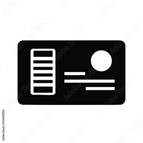 Close-up of a modern credit card with magnetic stripe and chip details on a plain
