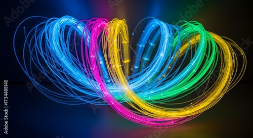 Abstract display of colorful illuminated light trails against a dark backdrop