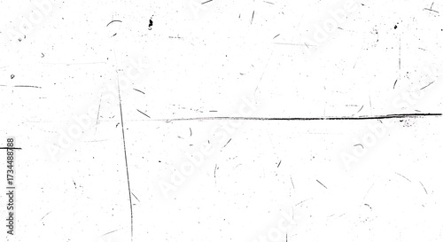 White surface covered in black scratches dust and imperfections