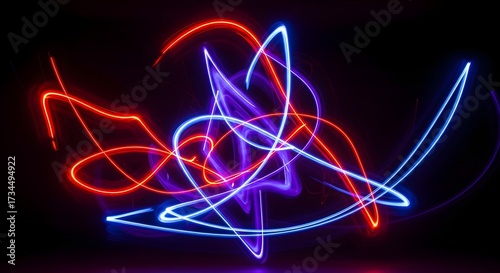 Abstract light trails in red and blue on black background